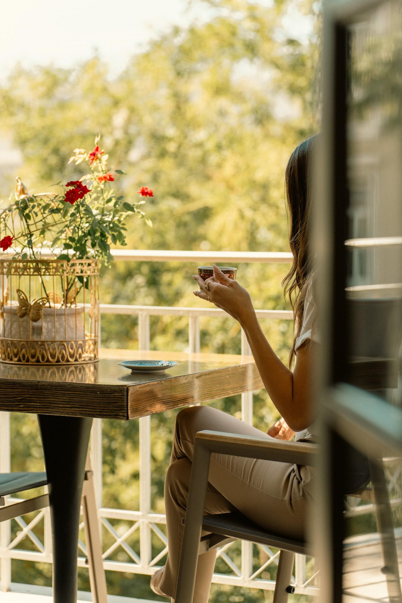 Morning coffee on a suite balcony among the trees